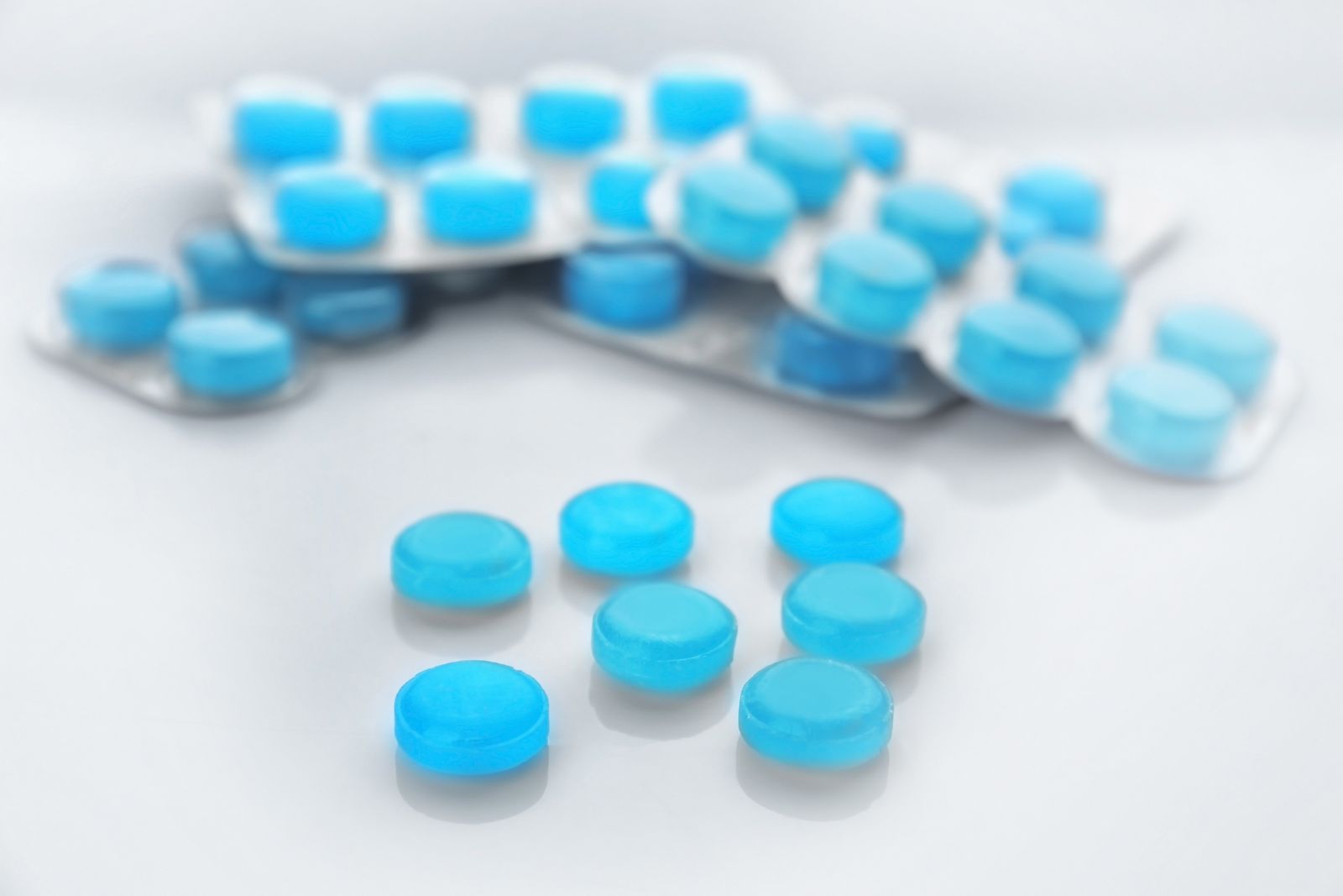 Cough drops on white background Laboratory line for candies